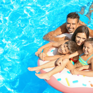 Family together showing the importance of pool safety by utilizing pool float.